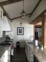 Bevolo Lighting adds to the charm of this country kitchen. All part of the recently renovated waterfront home on Northern Illinois