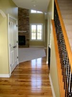 The warmth of Hickory flooring enhances this Pleasant Prairie homes foyer.