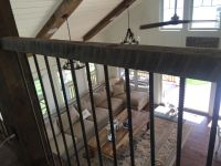 Hribar and vintage barn beams make for a unique loft railing 