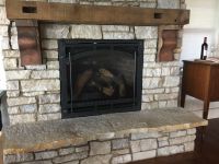 This Century Old Reclaimed Beam, became the mantel to this lakefront homes great room fireplace.
