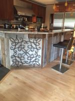 Unique detailed iron accents this kitchen island