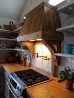 Reclaimed lumber enhances this hand crafted exhaust hood