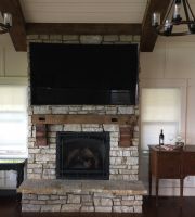 Movie nights and sporting events are enjoyed in front of this northern Illinois lakefront homes massive stone fireplace!