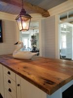 One of many unique details when designing this handcrafted kitchen island, was the choice to use Century Old reclaimed lumber for its top. Both for its warmth and durability.