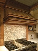 Beautiful custom tile work combine with Century Old Reclaimed Lumber and Barn Beams to make this area a true focal point of this newly remodeled Wisconsin Country Home kitchen.