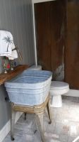 Vintage tin and an old wash tub finish this pool side changing area!