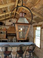 This beautiful Bevolo hand crafted Gaslamp adds warmth to this Wisconsin families Outdoor Room