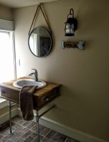 A hand crafted sink base created for this tiny loft bathroom