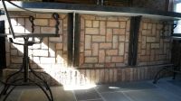 Specially designed outdoor room bar mating rugged steel with Chicago brick