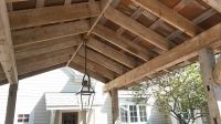 Century old barn beams combine with vintage corrigated tin to make this beautiful Pergola Roof